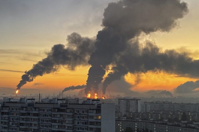 Plumes of smoke rise from fires (centre) at an oil refinery following what the authorities say is a Ukrainian drone strike in the course of the Russia-Ukraine conflict, in Moscow